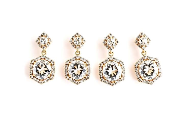 Artistic Display of Step Size Diamond Earrings on White Background